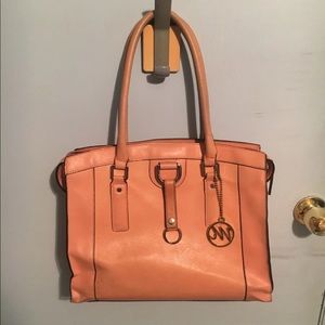 Peach shoulder bag with leopard print inside